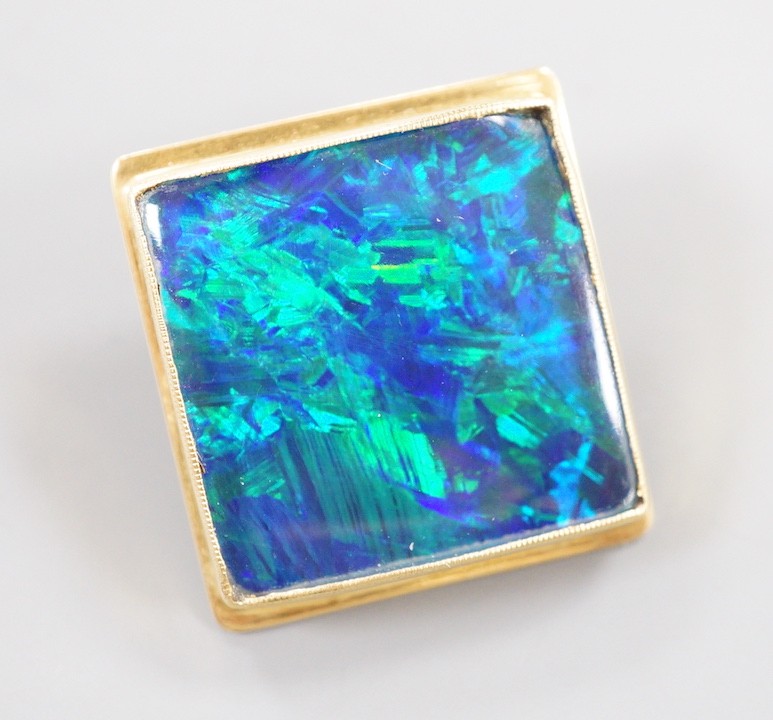 An 18ct mounted black opal square cufflink, 23mm, gross weight 11.6 grams.